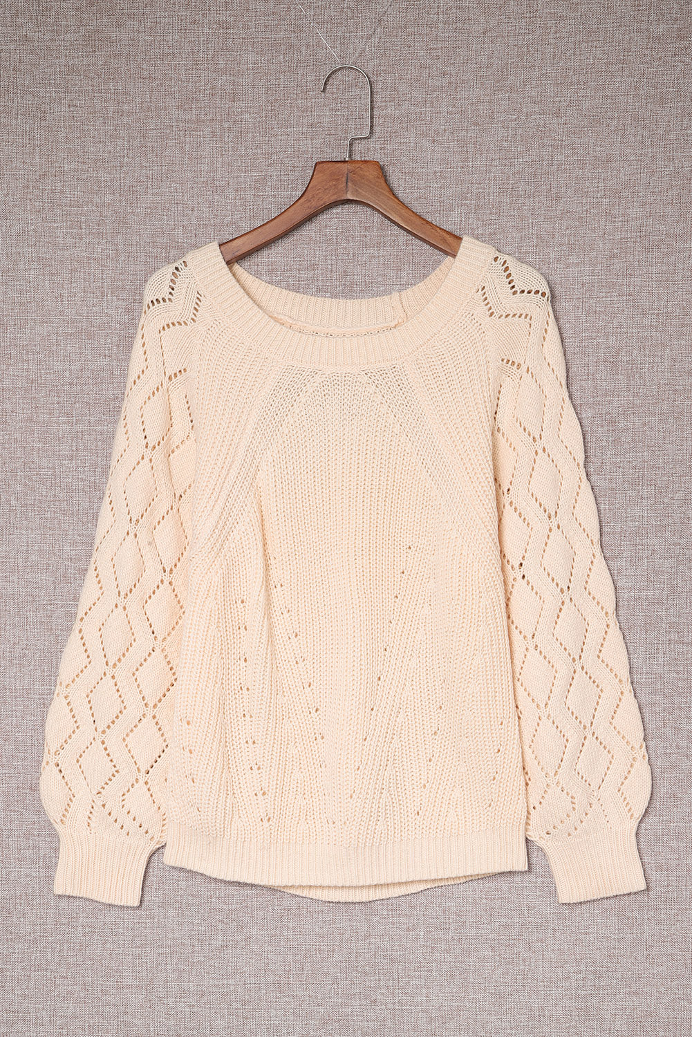 Pull en tricot beige chic à manches bouffantes et ajourées
