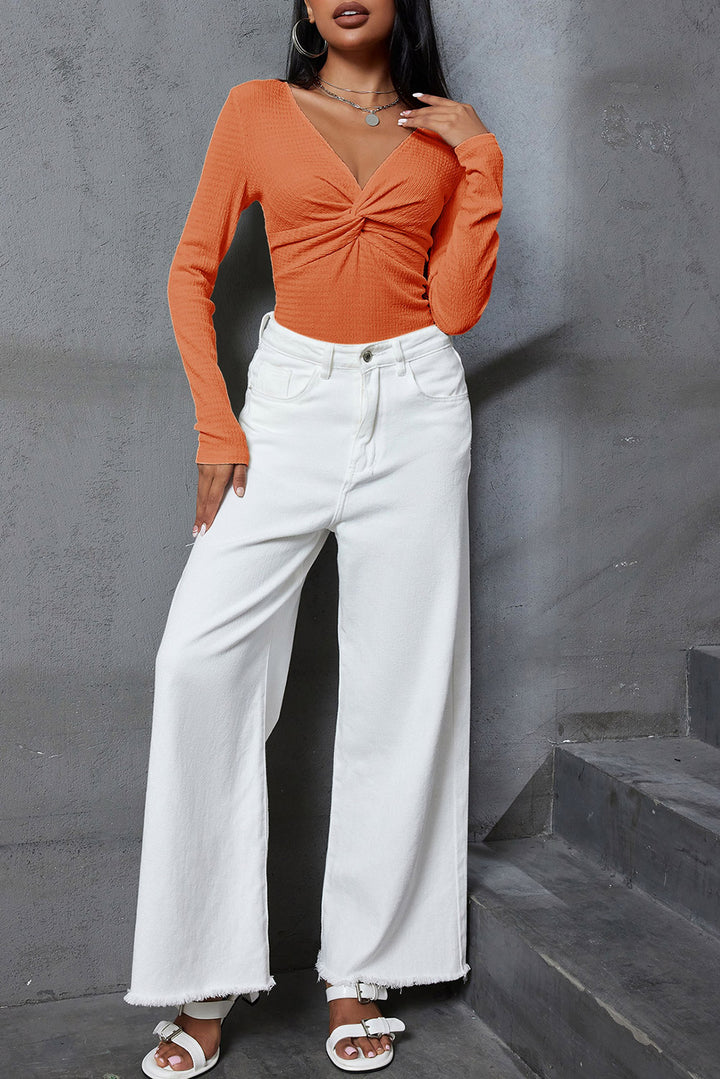 Orangefarbenes, strukturiertes, langärmliges, schmales, einfarbiges Oberteil mit V-Ausschnitt und verdrehter Vorderseite