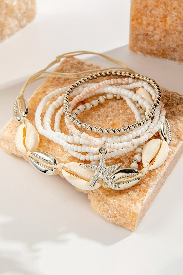 7-teiliges Perlenarmband-Set mit Seesternen und Muscheln