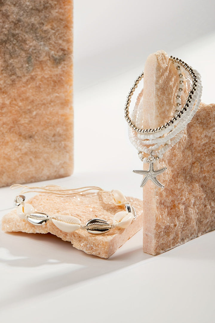 7-teiliges Perlenarmband-Set mit Seesternen und Muscheln