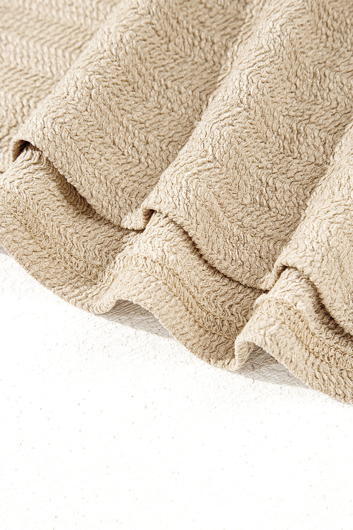 Helles Khaki-Oberteil mit V-Ausschnitt, langen Ärmeln und schmaler, einfarbiger Optik