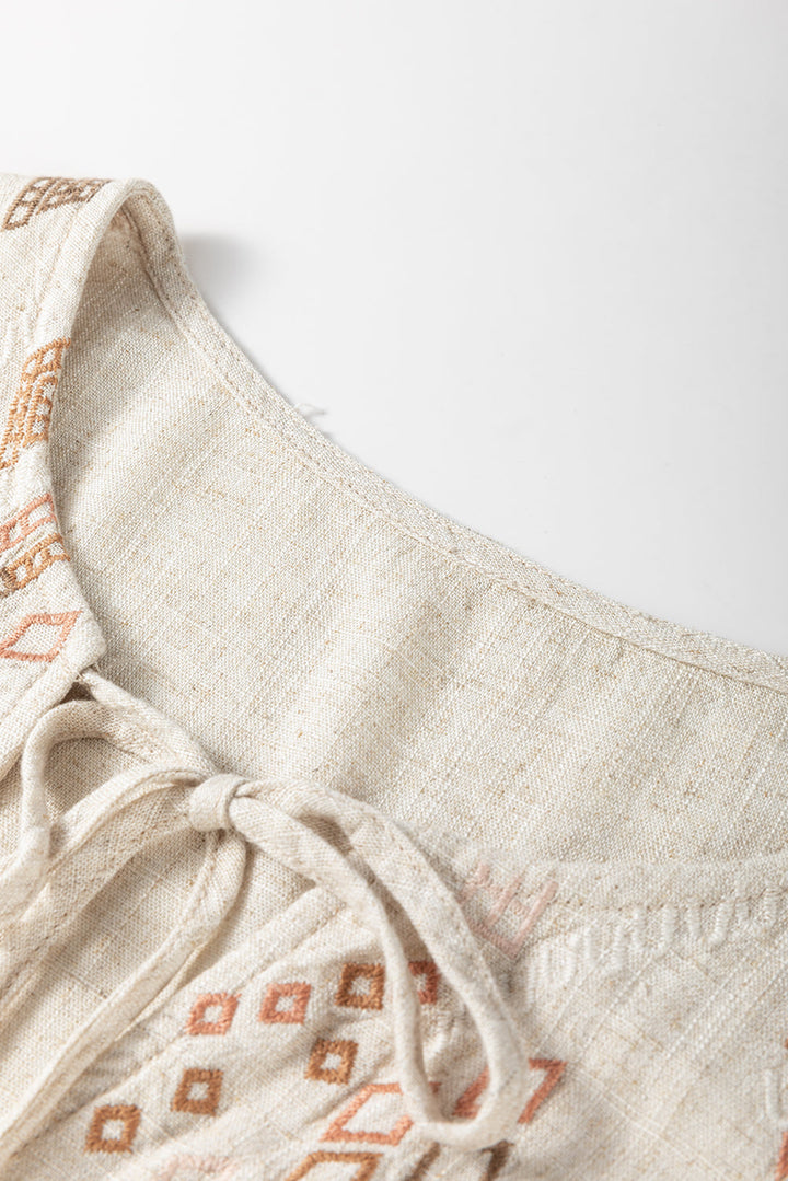 Geometric Embroidered Short Sleeve Tassel Tied V Neck Blouse