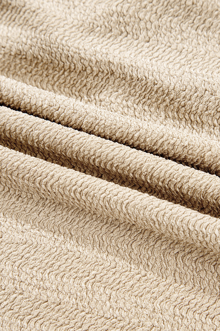 Helles Khaki-Oberteil mit V-Ausschnitt, langen Ärmeln und schmaler, einfarbiger Optik