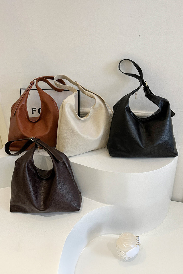 Ledertasche mit verstellbarem Riemen und einer Schulter