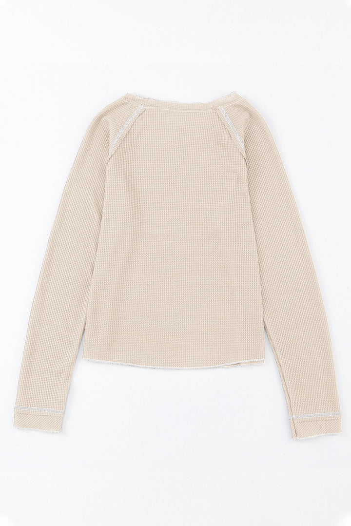 Aprikosenfarbenes, strukturiertes Langarm-Oberteil mit Rundhalsausschnitt