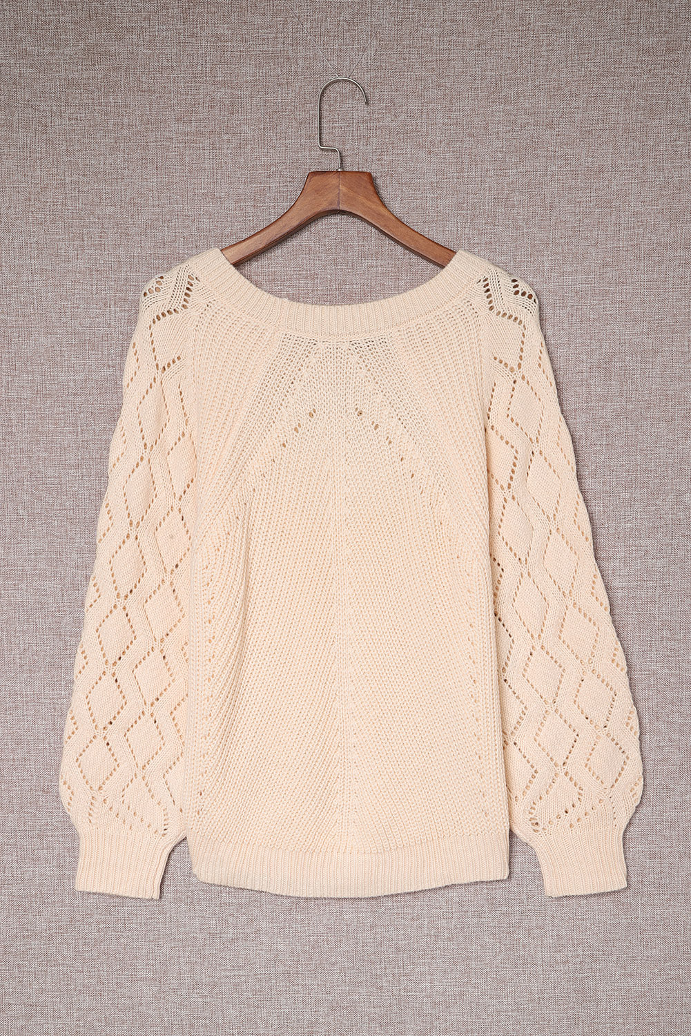 Pull en tricot beige chic à manches bouffantes et ajourées