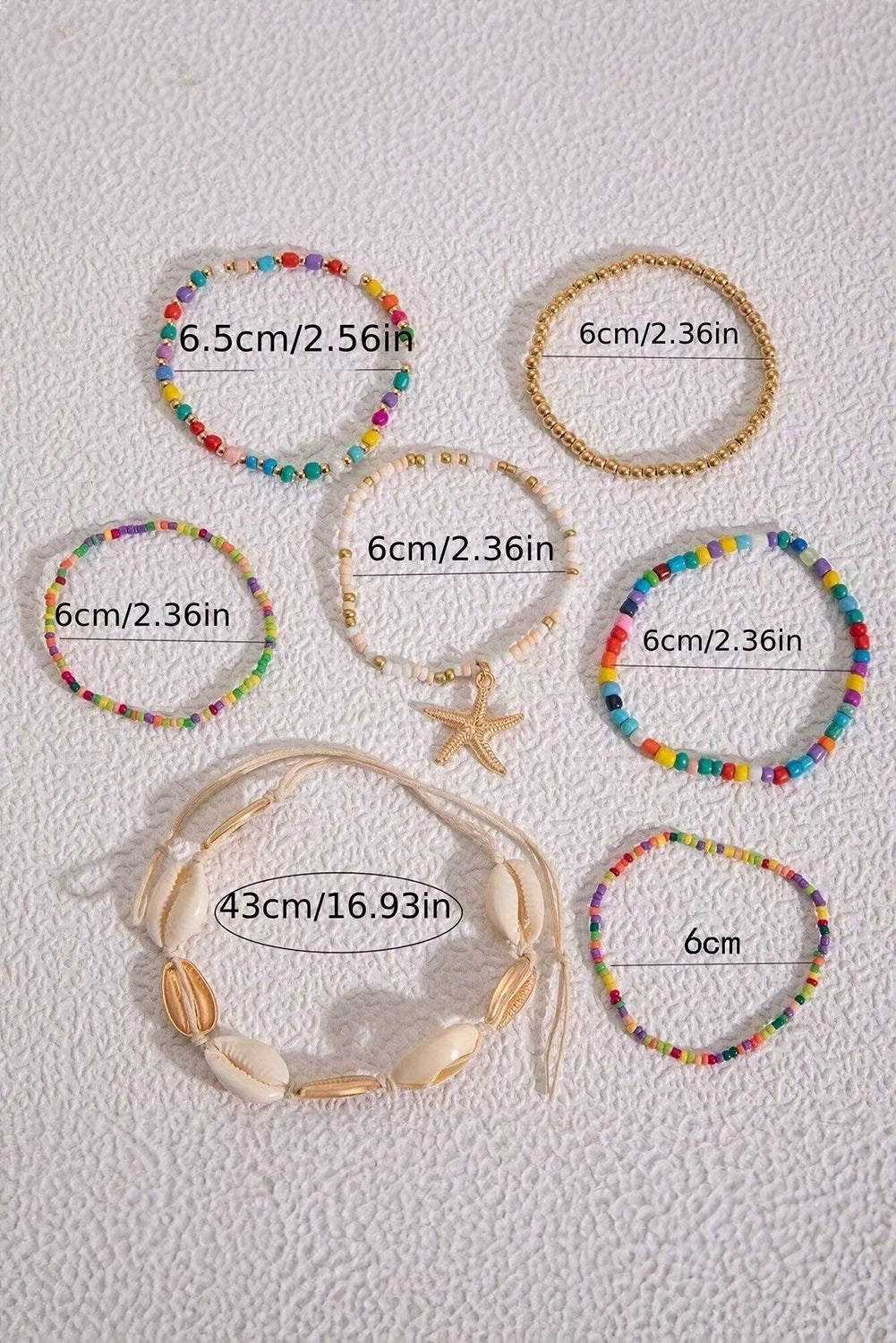 Ensemble de 7 bracelets en perles de coquillages et étoiles de mer