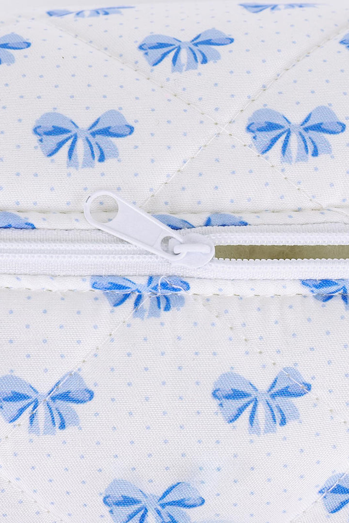 Trousse de maquillage matelassée à fermeture éclair et nœud papillon