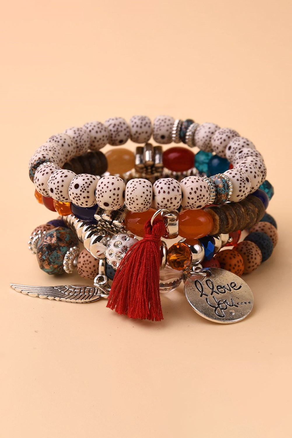 4-teiliges Perlenarmband-Set mit Flügel-Anhänger und Quaste