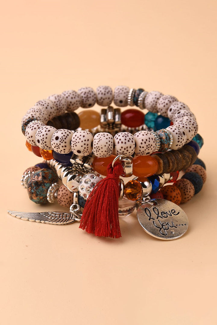 4-teiliges Perlenarmband-Set mit Flügel-Anhänger und Quaste