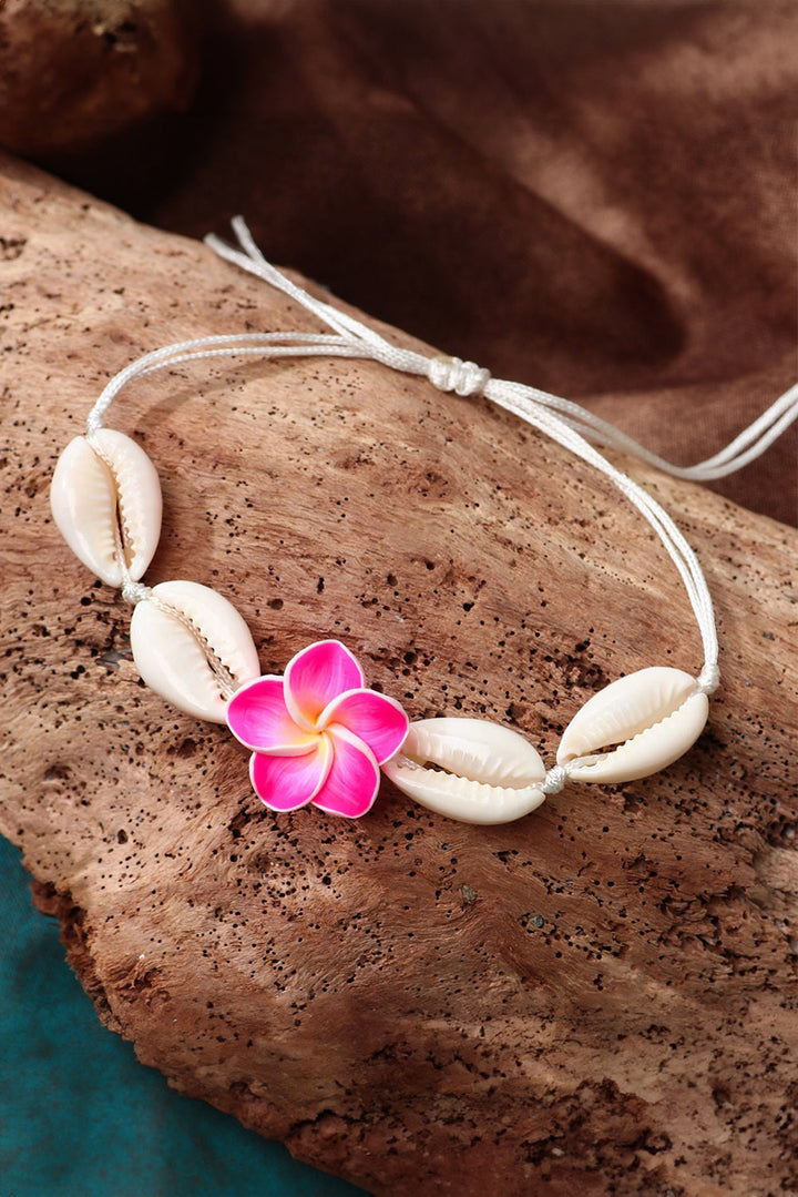 Bracelet ajustable en coquillage et fleurs