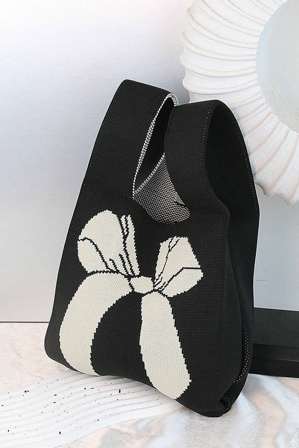 Sac à main tricoté à motif nœud papillon colorblock