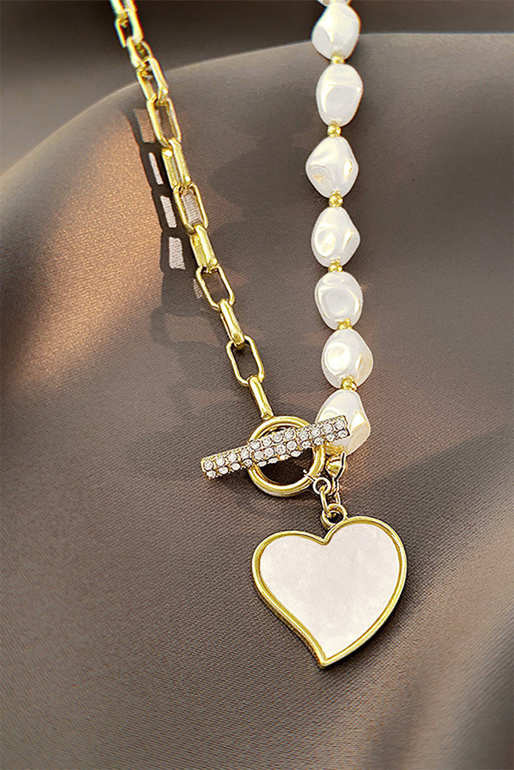 Collier avec pendentif en forme de cœur et chaîne de perles décorée de strass