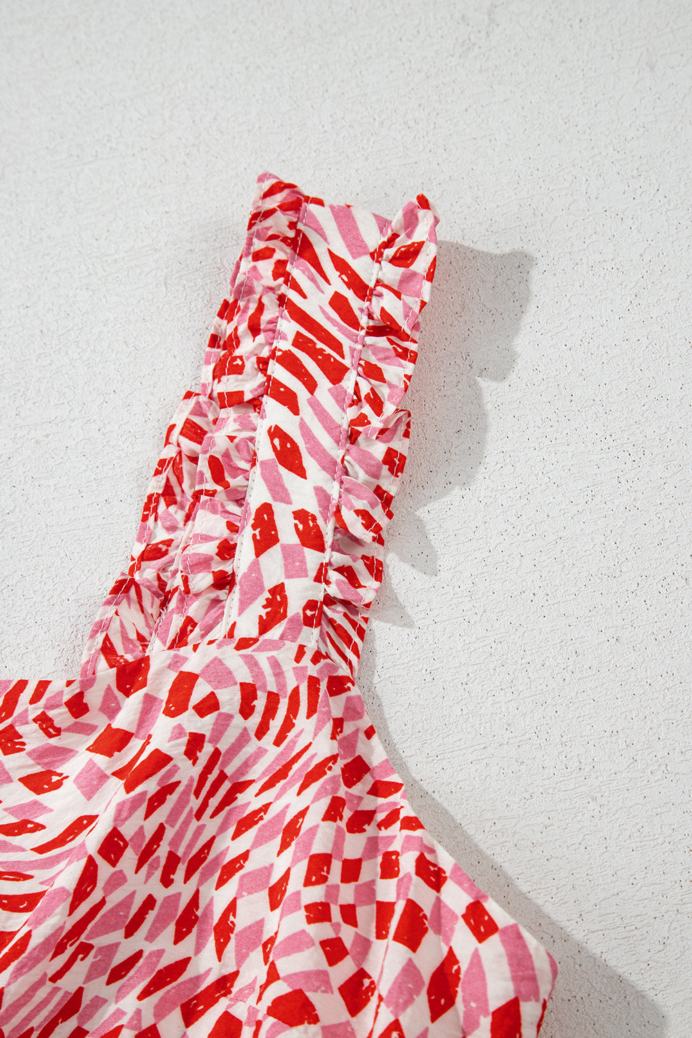 geometric print knot back sleeveless ruffle hem dress
