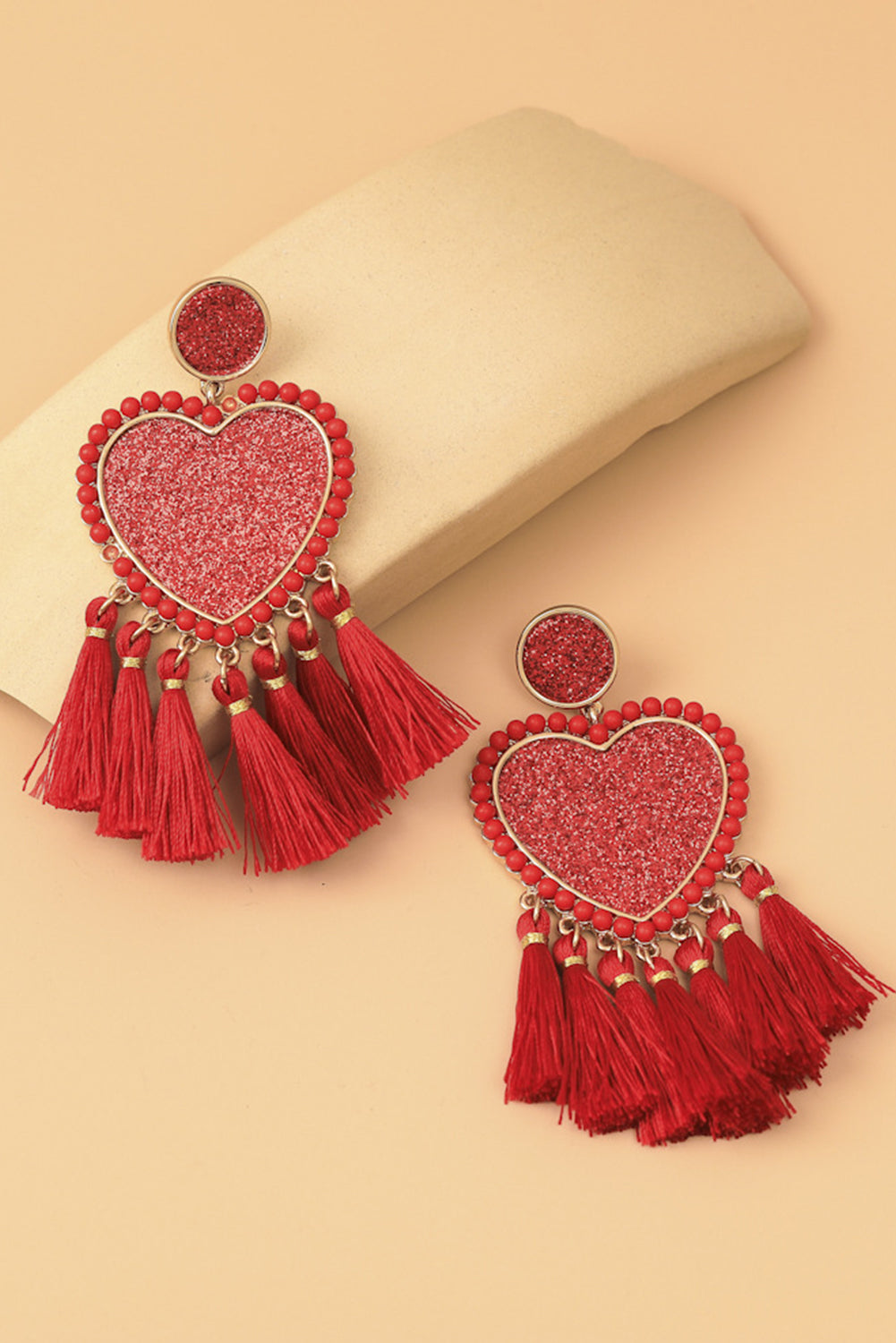 Boucles d'oreilles pendantes à pompons en forme de cœur