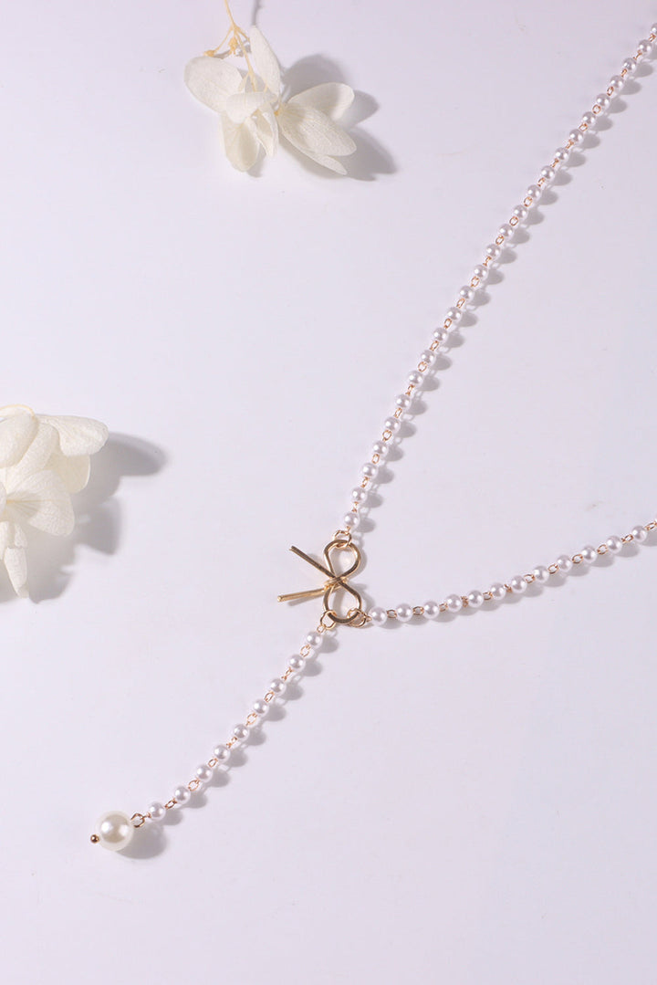 Collier en chaîne de perles avec nœud plaqué