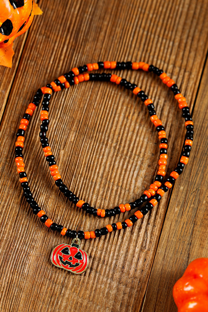 Collier d'Halloween avec pendentif en forme de visage de citrouille et perles de riz