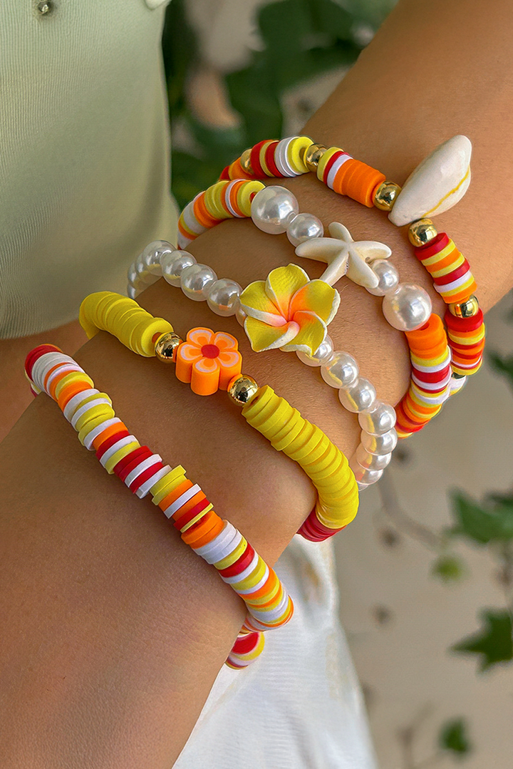 Bracelet multicouche en perles, coquillages, étoiles de mer et fleurs