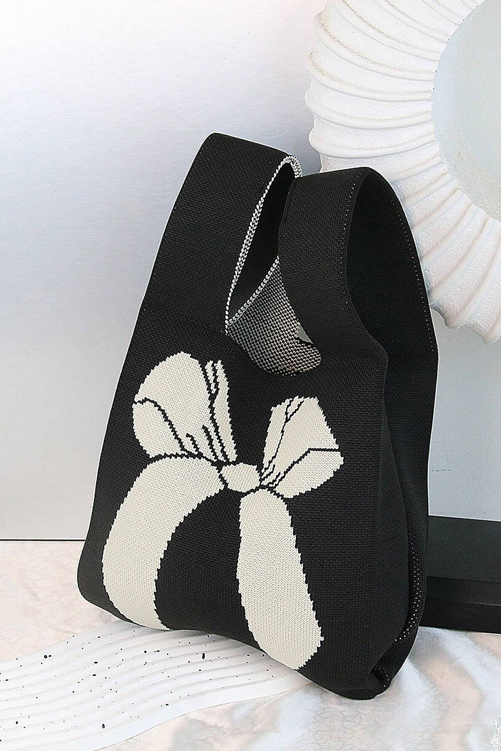 Sac à main tricoté à motif nœud papillon colorblock