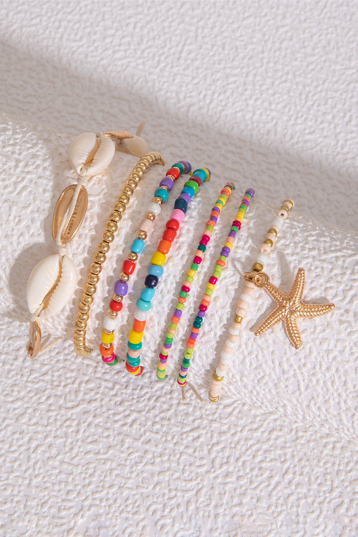 7-teiliges Perlenarmband-Set mit Seesternen und Muscheln
