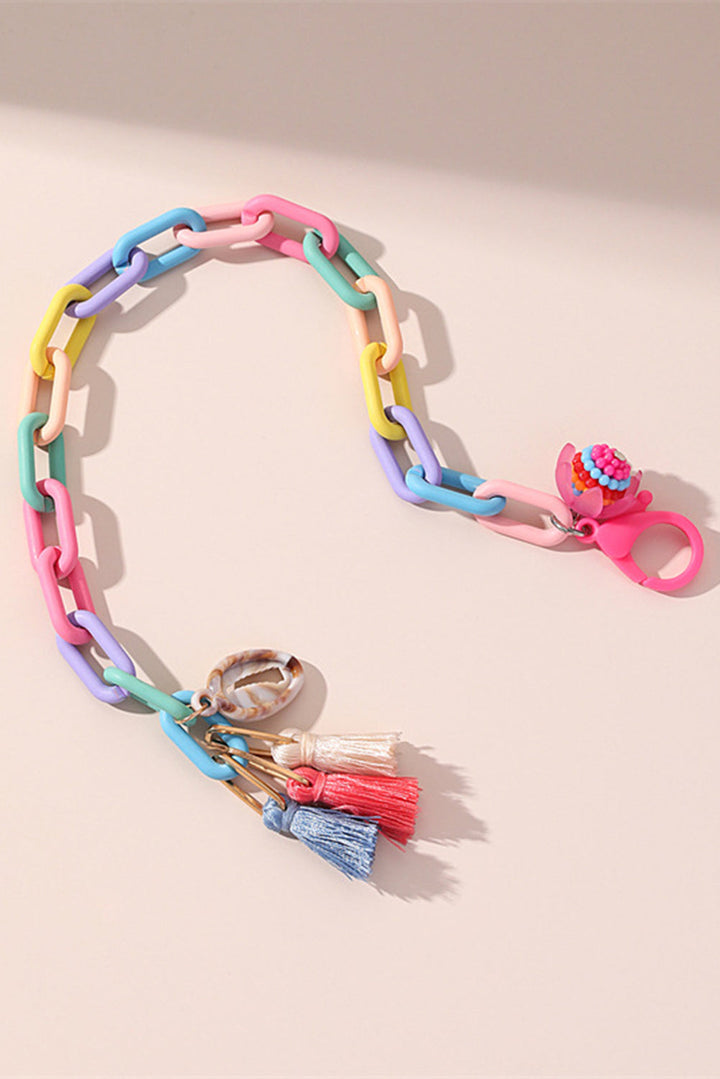 Bracelet de cheville réglable à maillons colorés avec pompon coquillage