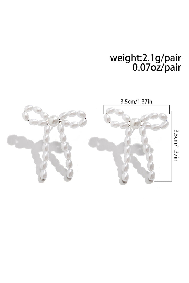 Boucles d'oreilles cloutées en perles et nœud papillon