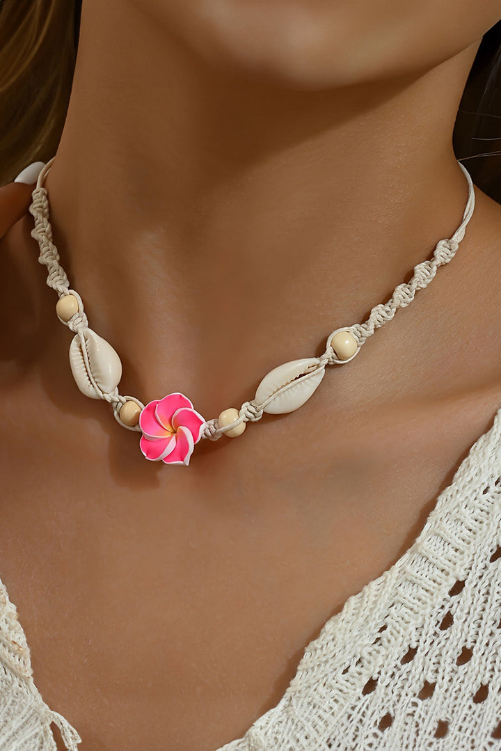 Collier ras du cou tressé en coquillage et fleurs