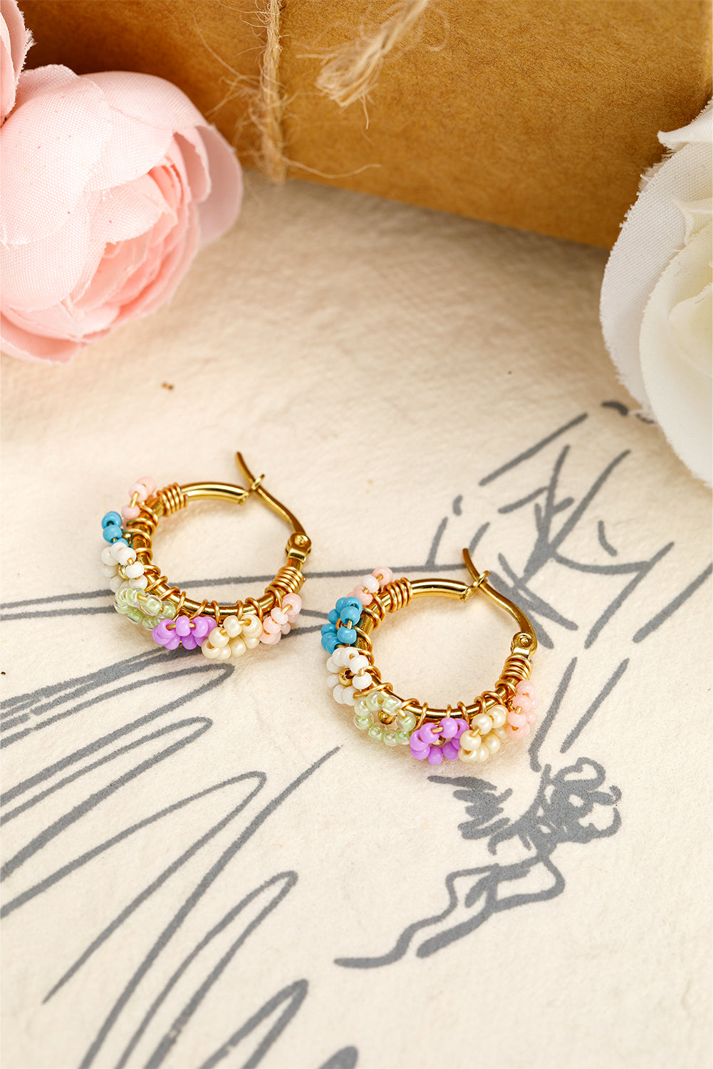 Boucles d'oreilles créoles en alliage avec fleurs perlées