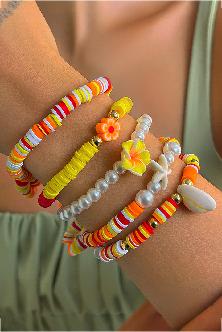 Bracelet multicouche en perles, coquillages, étoiles de mer et fleurs