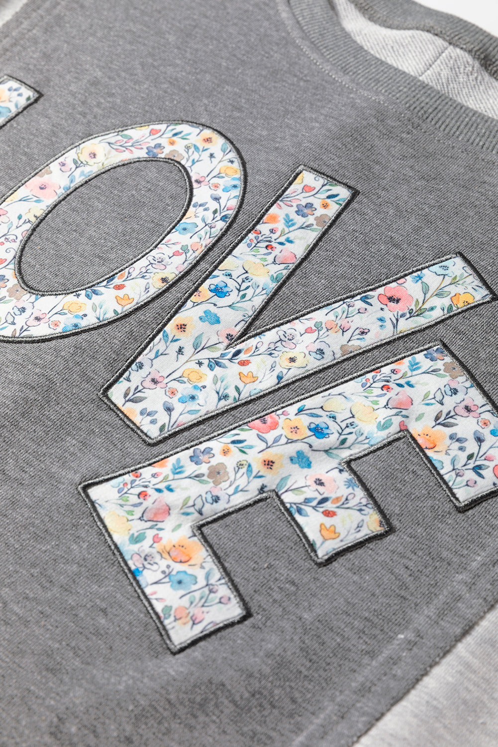 LOVE Graphic Exposed Seam Patchwork Uneven Hem Chic Sweatshirt