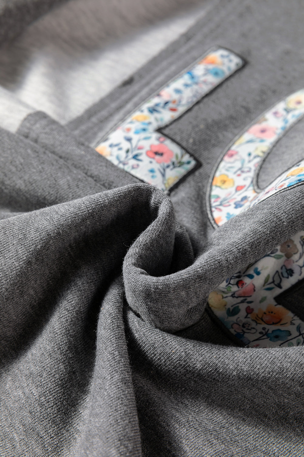 LOVE Graphic Exposed Seam Patchwork Uneven Hem Chic Sweatshirt