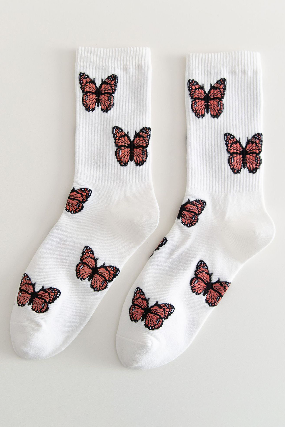 Chaussettes mi-mollet souples à bord côtelé et motif papillon