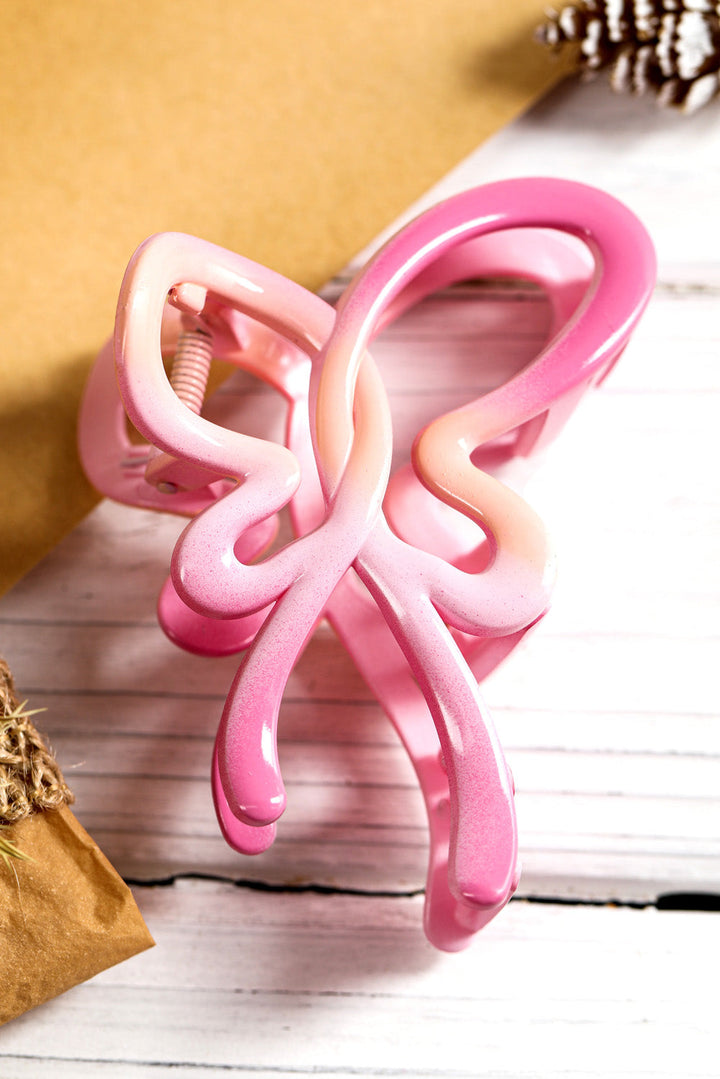 Pince à cheveux brillante en forme de papillon