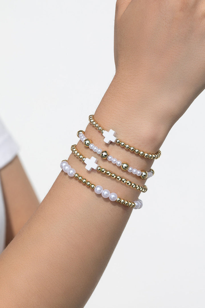 Bracelet élastique multicouche en perles avec décor de croix