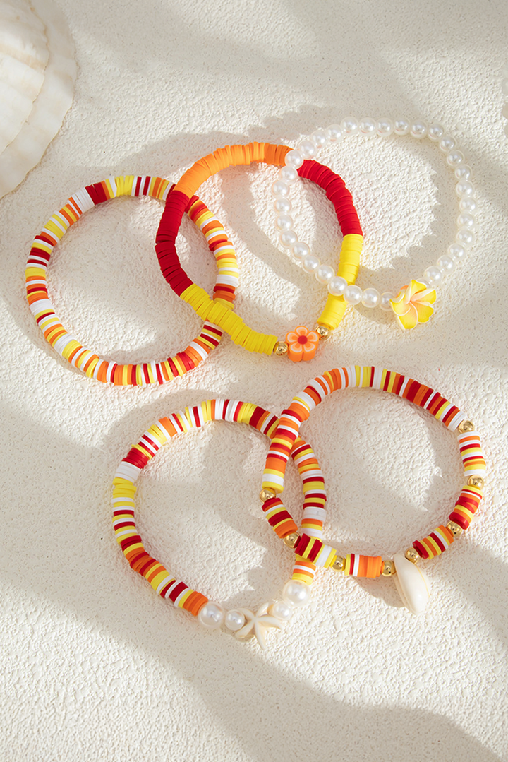 Bracelet multicouche en perles, coquillages, étoiles de mer et fleurs