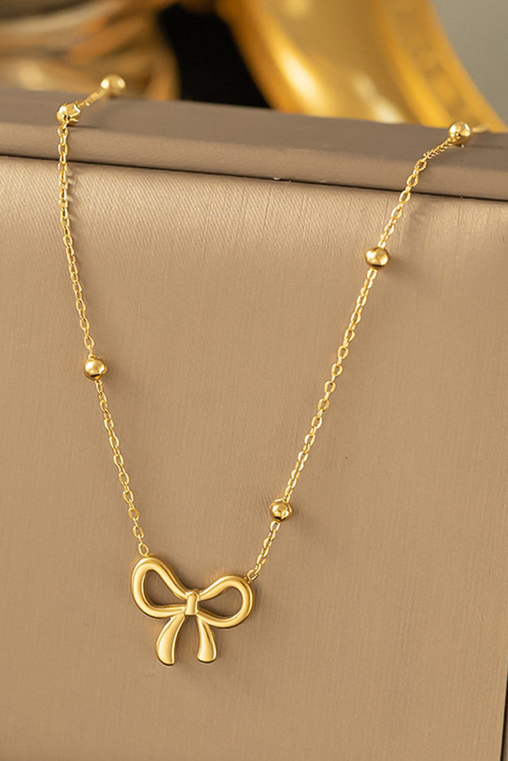 Collier ras du cou plaqué avec pendentif nœud papillon