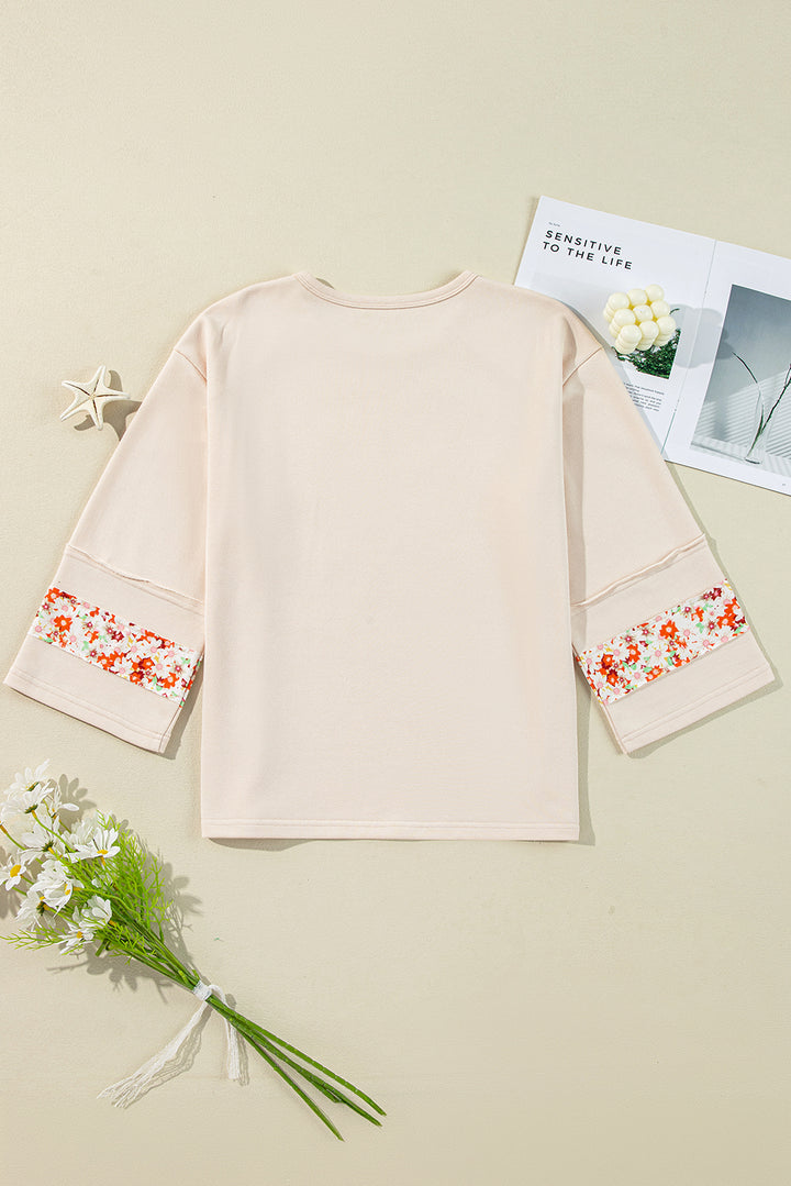 Flower Patch Graphic Exposed Seam Wide Sleeve Top