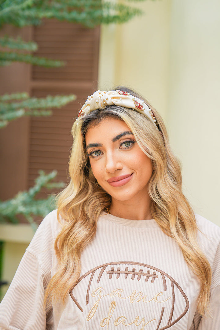 Bandeau à nœud torsadé avec perles de cristal et détails rugby LOVE