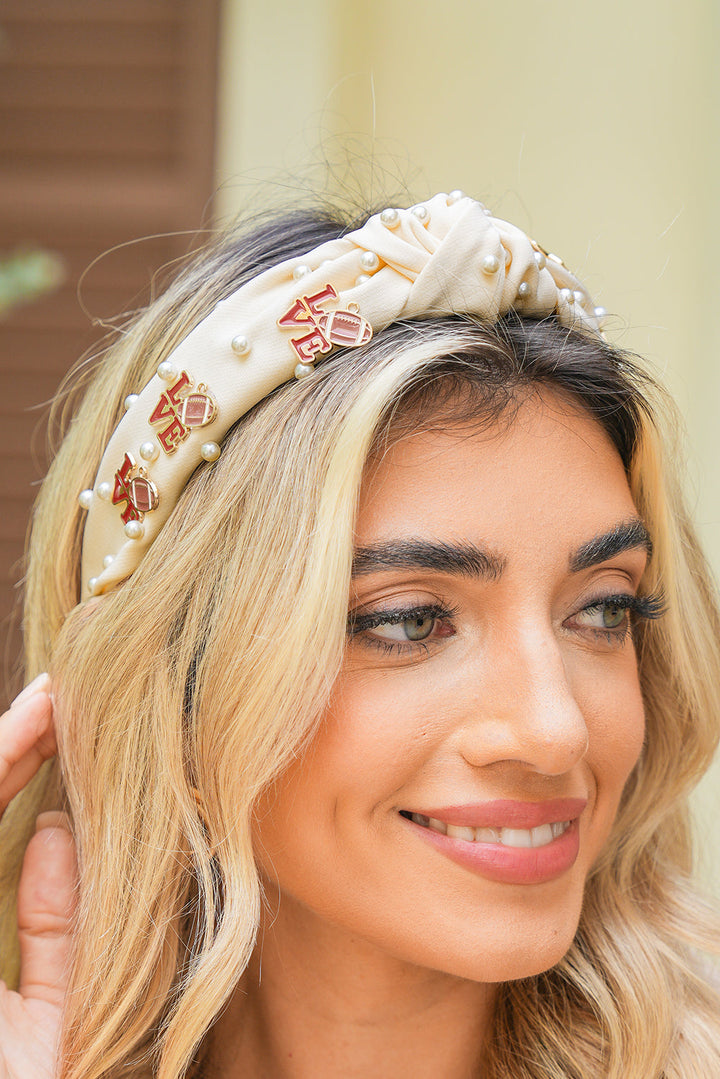 Bandeau à nœud torsadé avec perles de cristal et détails rugby LOVE