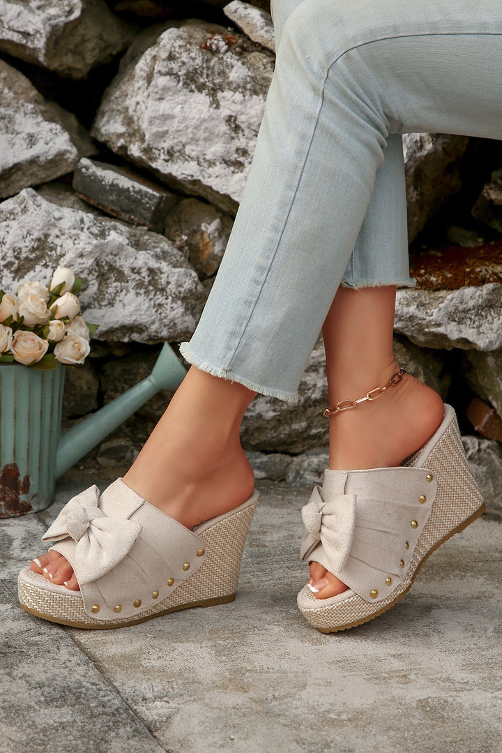 Chaussons compensés tissés en faux daim avec nœud décoratif