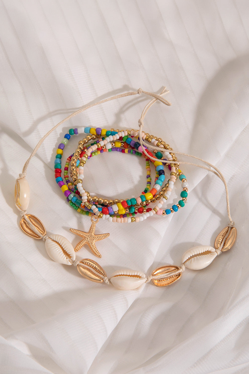 7-teiliges Perlenarmband-Set mit Seesternen und Muscheln