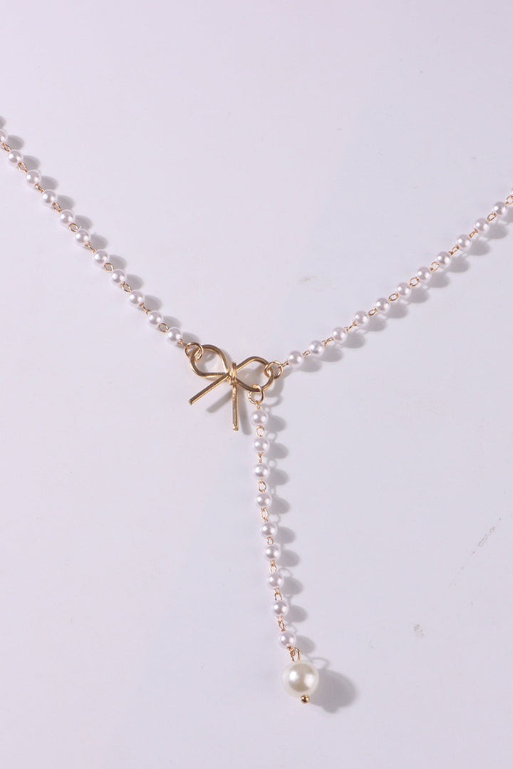 Collier en chaîne de perles avec nœud plaqué