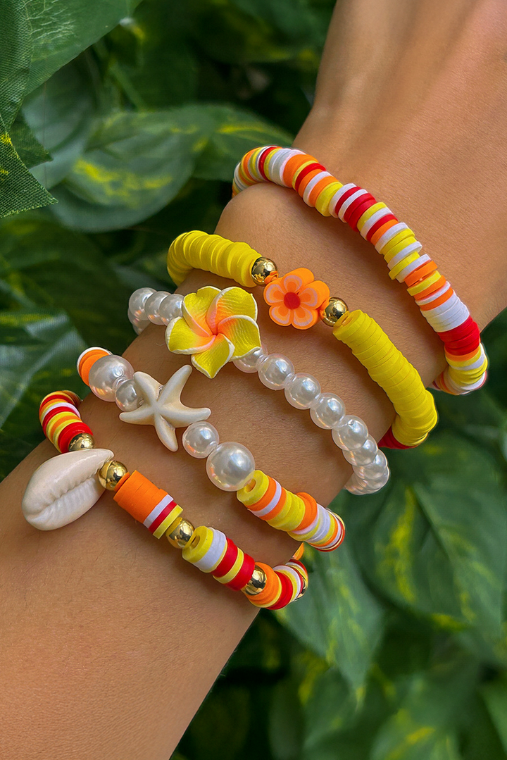Bracelet multicouche en perles, coquillages, étoiles de mer et fleurs