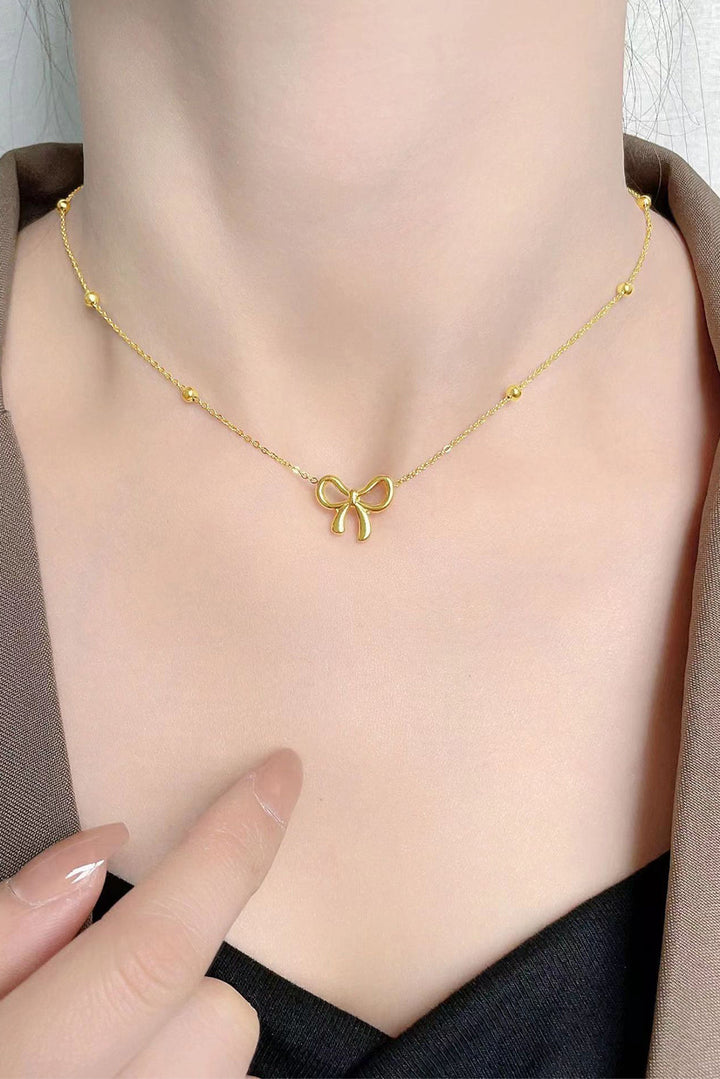 Collier ras du cou plaqué avec pendentif nœud papillon