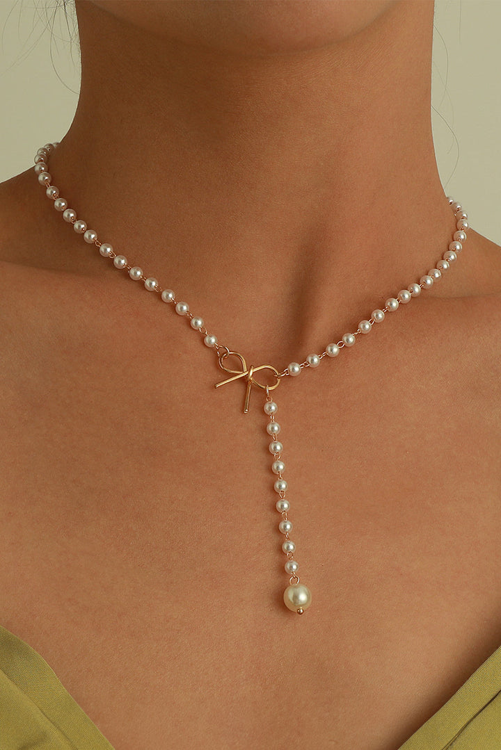 Collier en chaîne de perles avec nœud plaqué