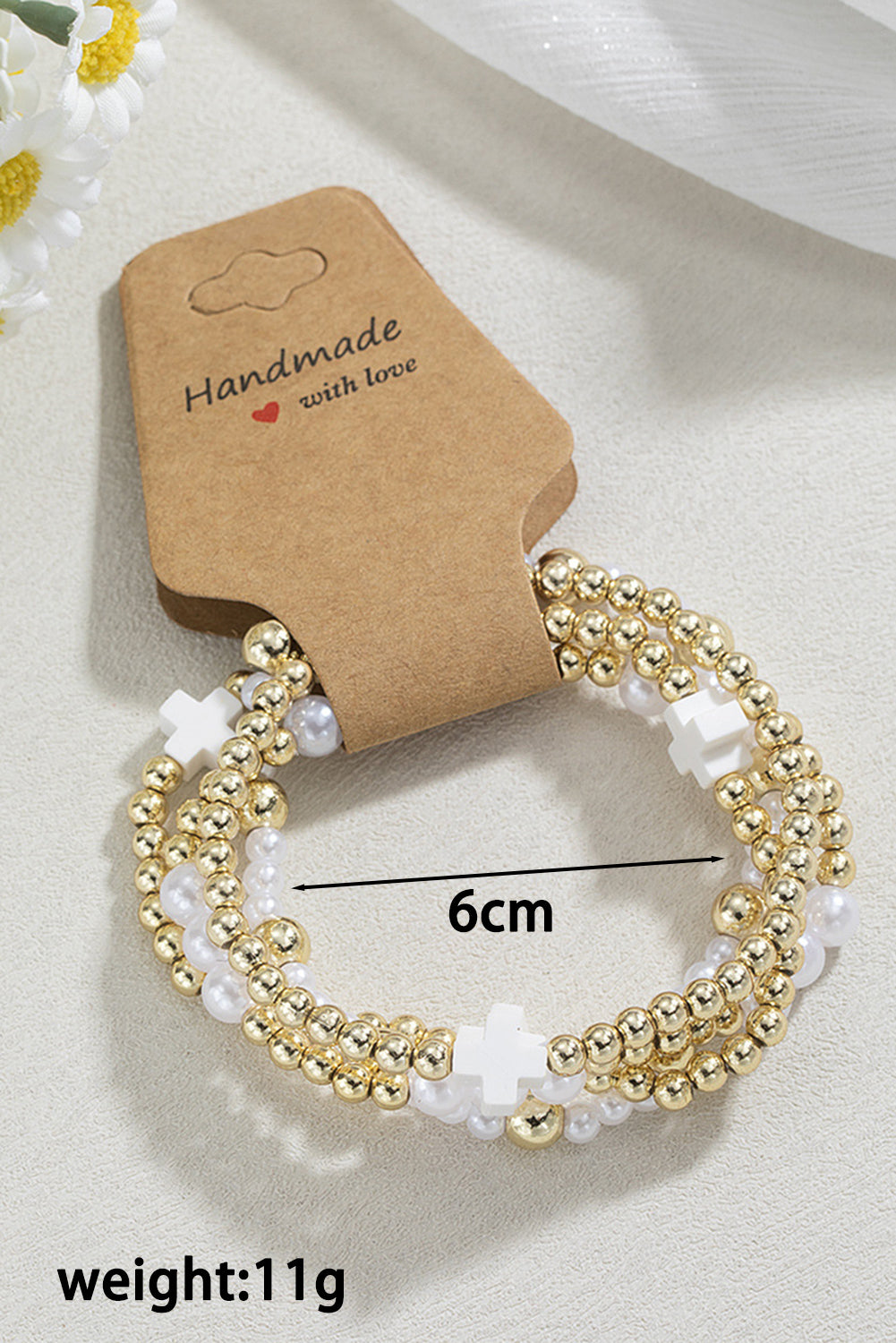 Bracelet élastique multicouche en perles avec décor de croix