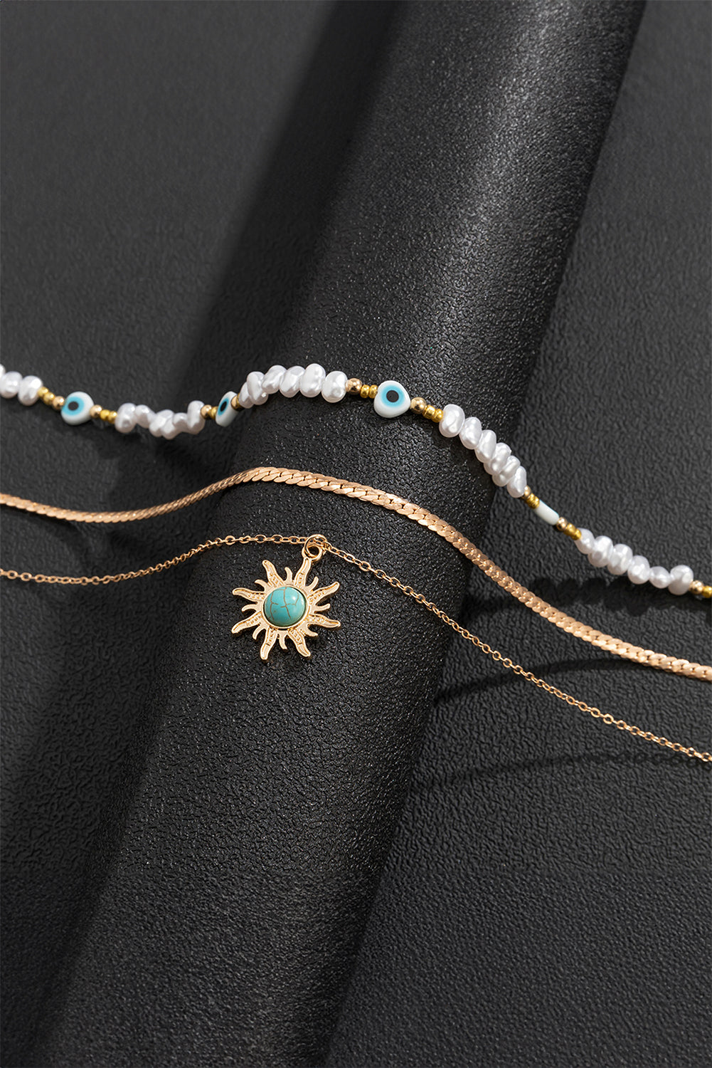 Collier pendentif multicouche en perles turquoises et perles de soleil