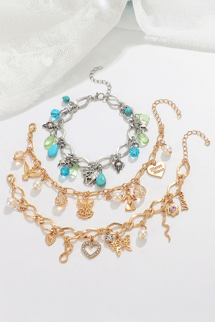 Bracelet en alliage plaqué avec breloque en forme de cœur, papillon et perles