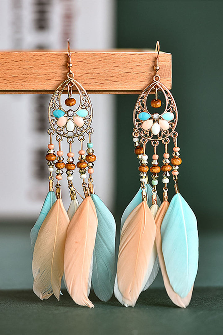 Boucles d'oreilles bohèmes à pompons et plumes creuses