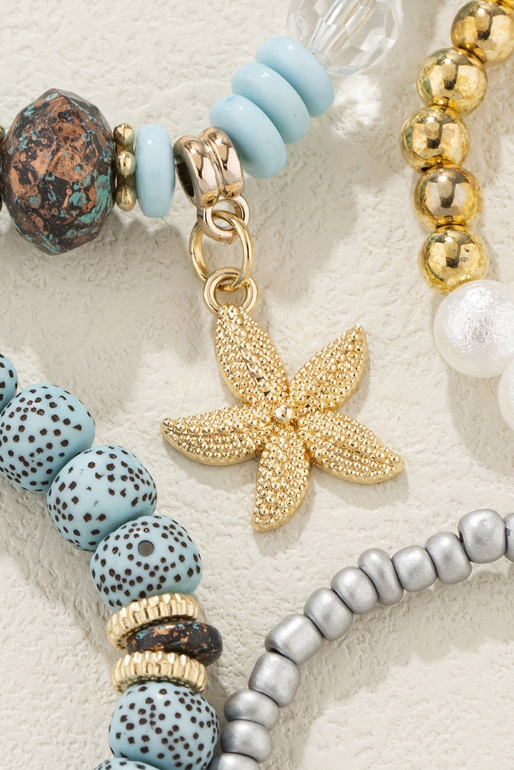 Ensemble de 4 bracelets de perles avec pendentif étoile de mer